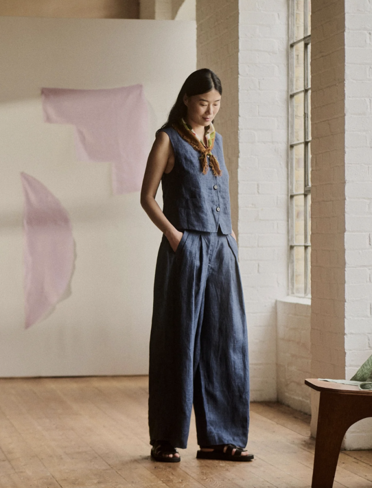 Model wearing a navy linen waistcoat from Toast with matching Belted Linen Wide Leg Pants